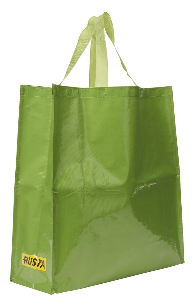 En blank grønn Handlepose Large Spring av vevd materiale, med håndtak og en gul Rusta-logo.
