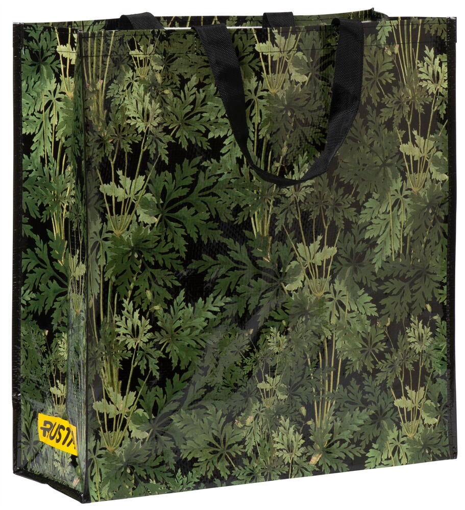 Stor shoppingkasse med grönt bladmönster och textilhandtag.