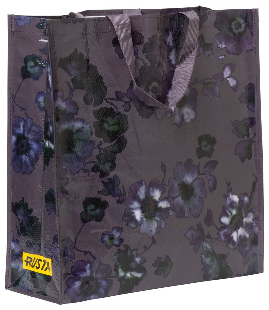 Stor shoppingkasse med blommigt mönster och textilhandtag.