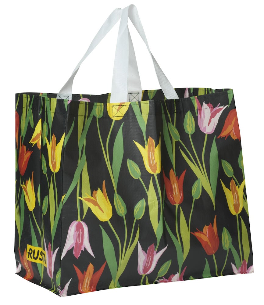 Ostoskassi Medium Kevät, musta uudelleenkäytettävä kassi värikkäällä tulppaanikuviolla, valkoisilla kahvoilla ja Rusta-logolla.