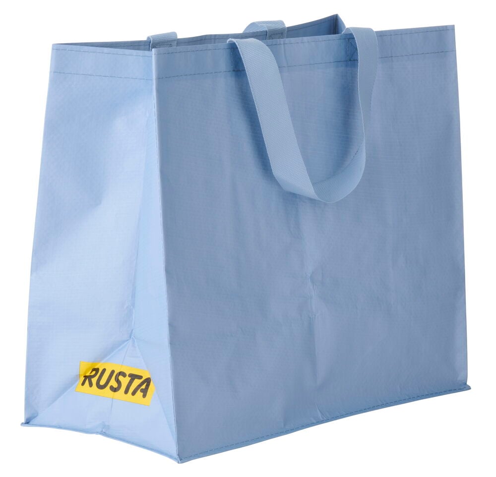 Vaaleansininen uudelleenkäytettävä Ostoskassi Medium Kevät, jossa on kaksi kangaskahvaa, kolmen neljänneksen kuvakulmasta.