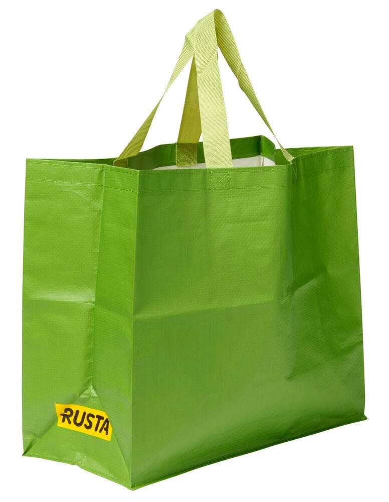 Vihreä Ostoskassi Medium Kevät, jossa vaaleanvihreät kahvat ja keltainen RUSTA-logo edessä.