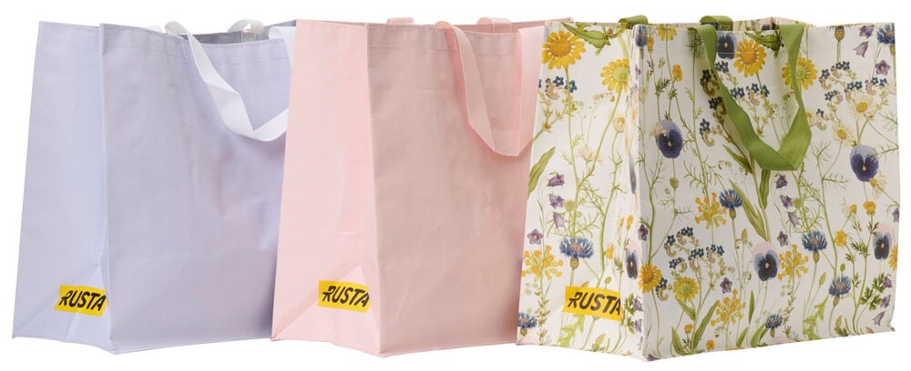 Drei Einkaufstaschen in verschiedenen Farben und Mustern.