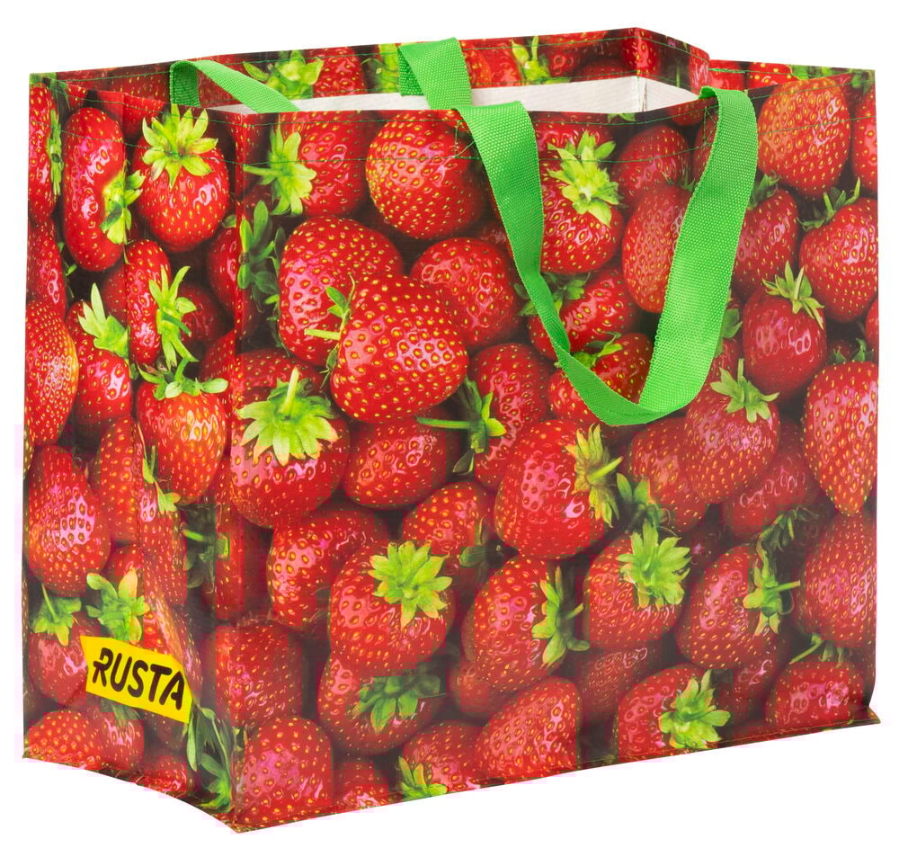 Einkaufstasche mit Erdbeermuster und grünen Griffen.