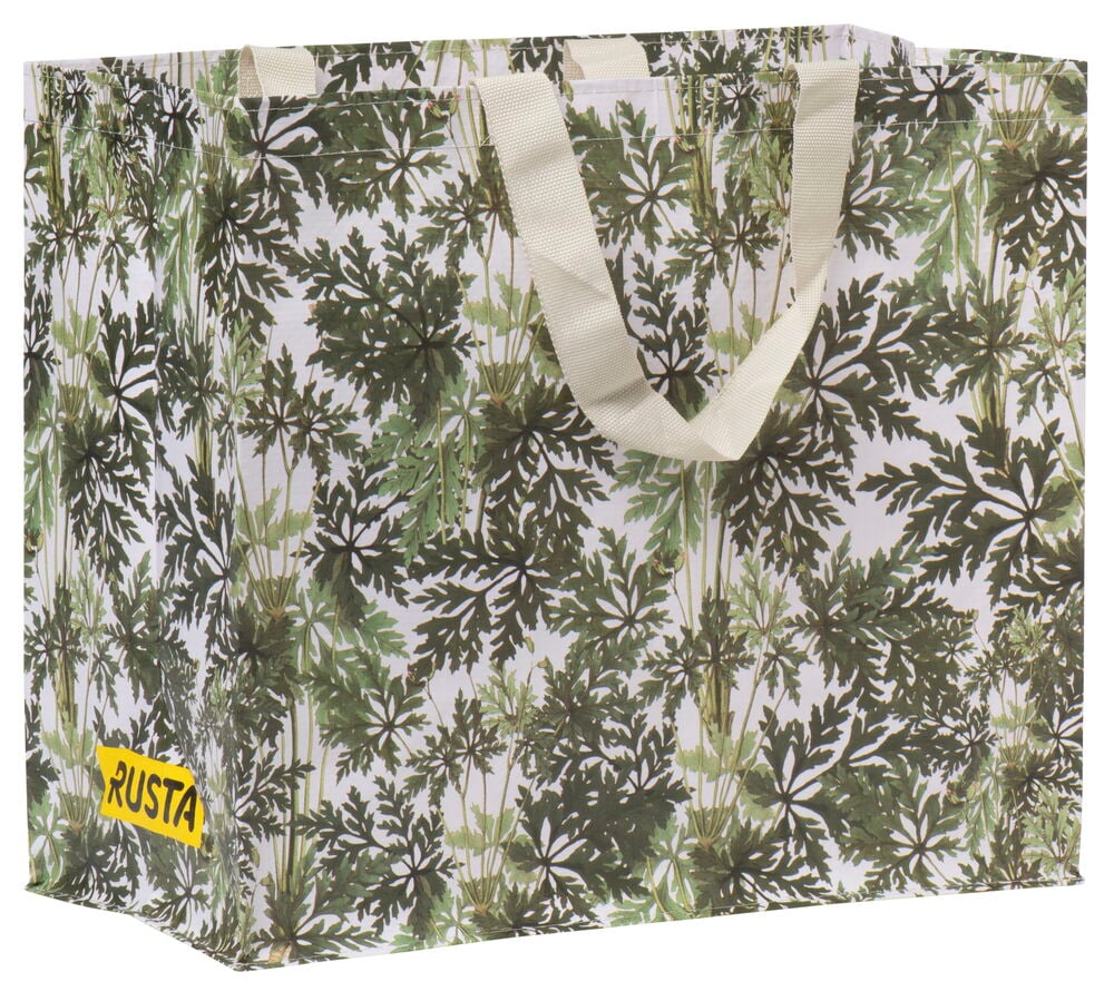 Shoppingkasse med grönt bladmotiv och textilhandtag.