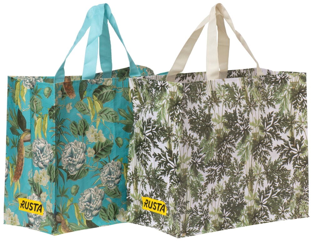 Två shoppingkassar med olika blommiga mönster.