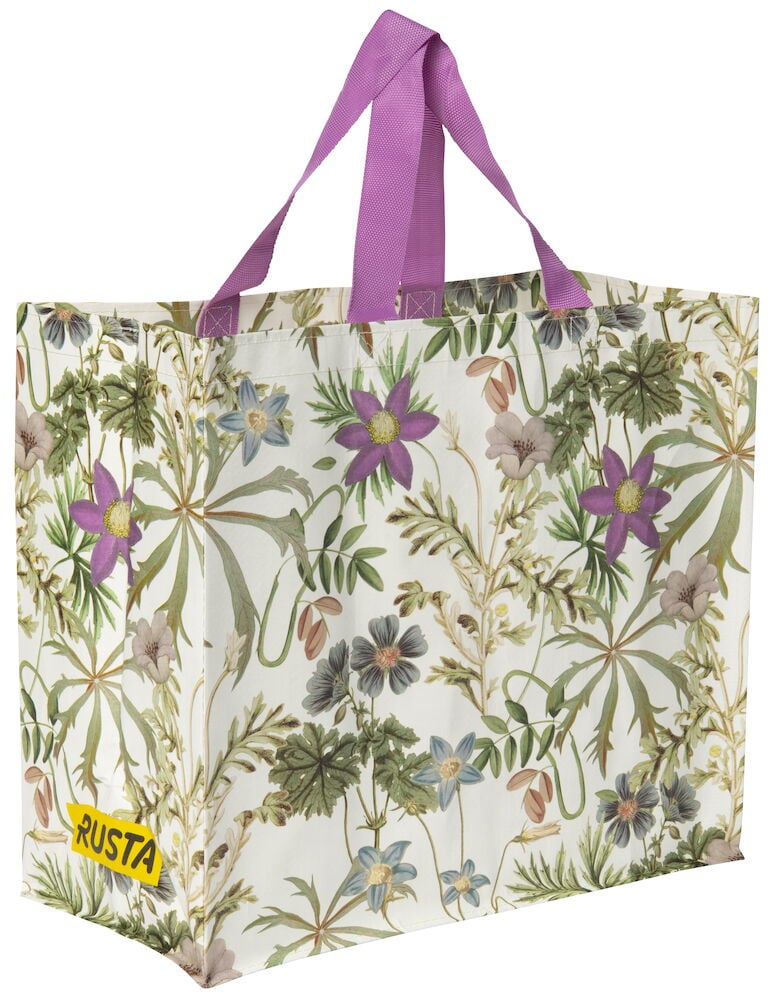 Shoppingkasse med blommigt mönster och lila handtag.