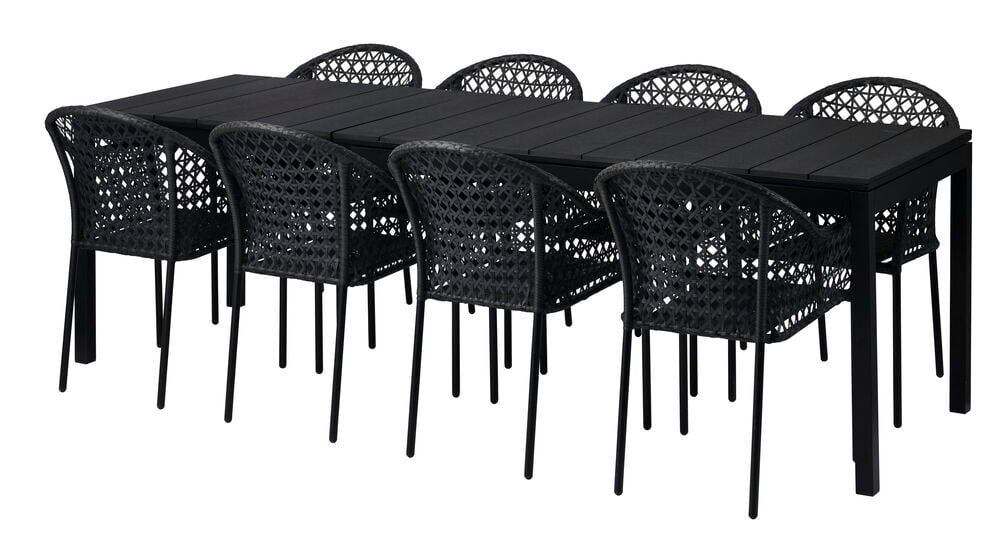 Laajennettava musta ruokapöytä kahdeksalla yhteensopivalla tuolilla.