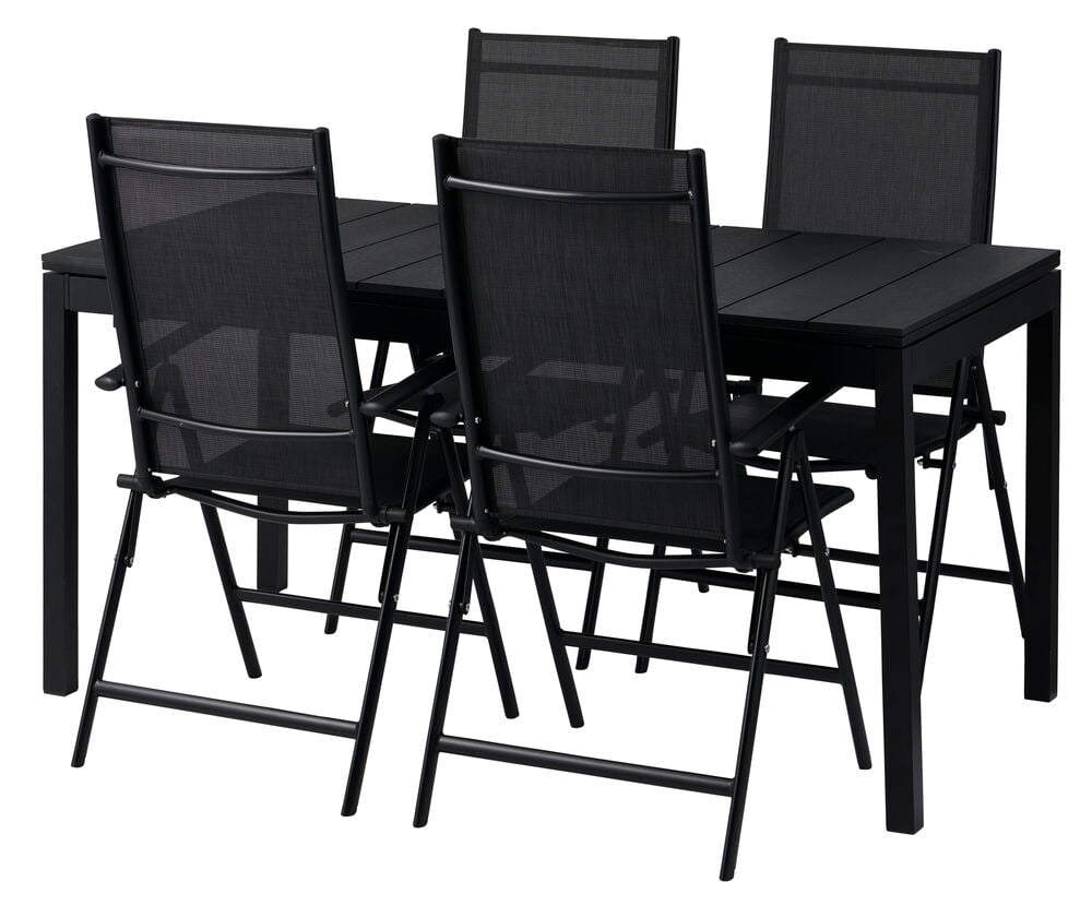 Musta jatkettava pöytä neljällä mustalla tuolilla.