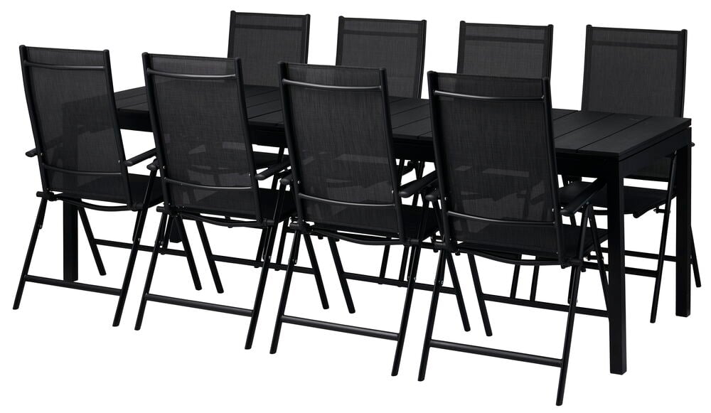 Musta jatkettava pöytä, jossa on kahdeksan mustaa tuolia.