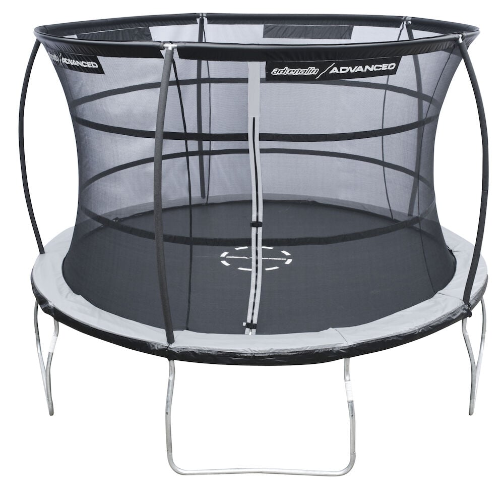 Pyöreä trampoliini turvaverkolla ja neljällä jalalla.