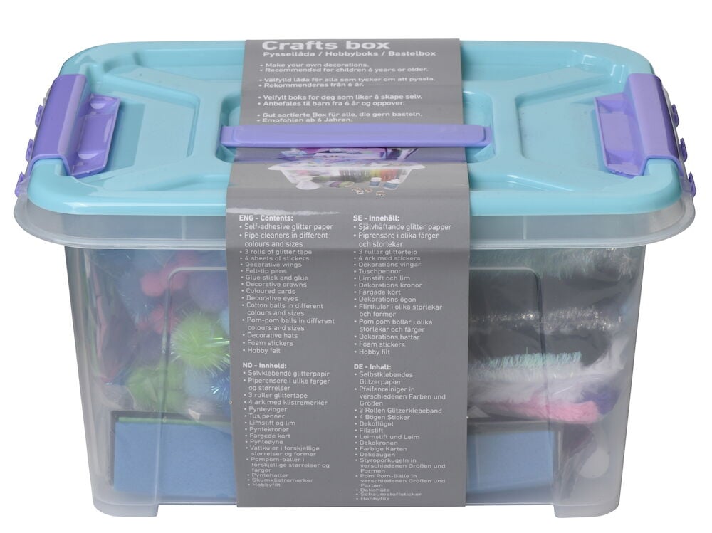 Turkos pyssellåda med handtag och synligt pysselmaterial.