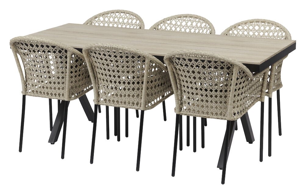 Rektangulärt bord med sex flätade stolar runt.