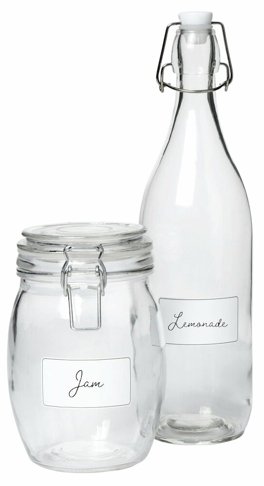 Lasipullo, jossa on patenttikorkki lasipurkin vieressä.