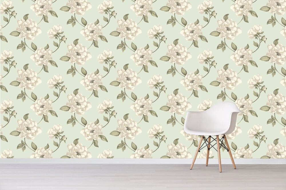 Grön tapet med ljust blommönster och vit stol.