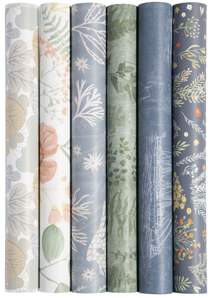 Sex rullar mönstrad tapet i olika färger.