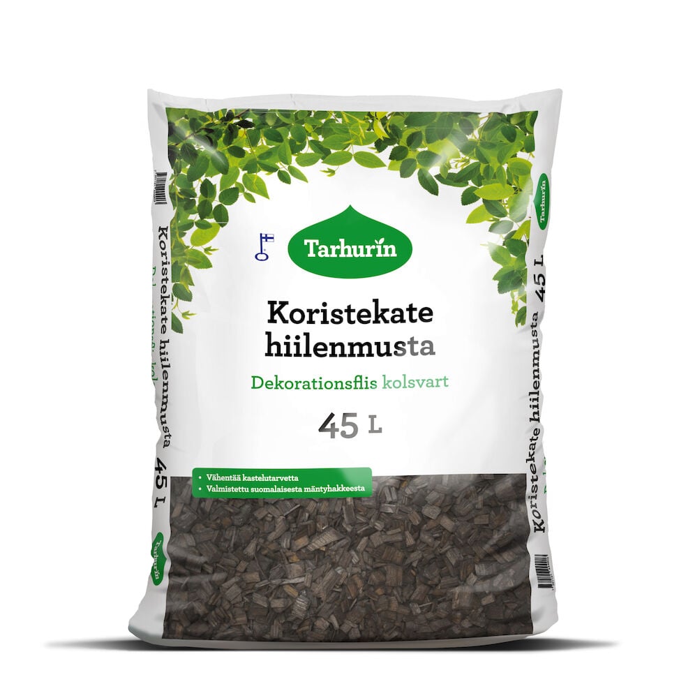 Musta muovipussi koristehaketta vihreillä lehtikuvioilla.